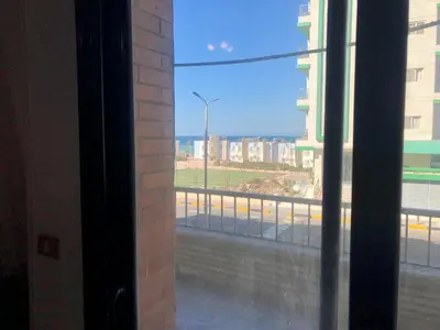 a view of a city street from a window at Sea view apartment in Hurghada
