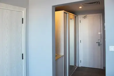 a room with a hallway with a door and a closet at Shellghada Blue Beach in Hurghada