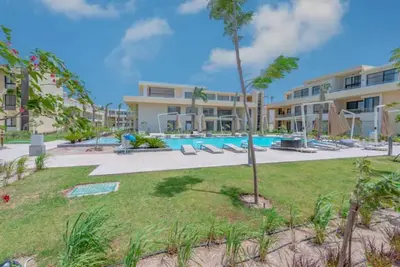 a large apartment building with a swimming pool at Ground Floor Studio - G Cribs -Elgouna in Hurghada