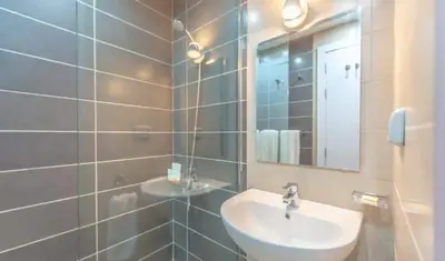 a bathroom with a sink and a mirror at Ground Floor Studio - G Cribs -Elgouna in Hurghada