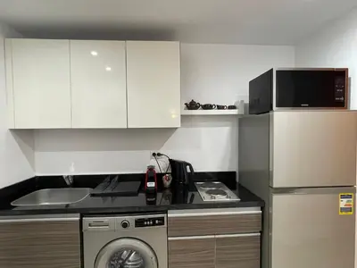 a kitchen with a washer and a sink and a dishwasher at Ground Floor Studio - G Cribs -Elgouna in Hurghada
