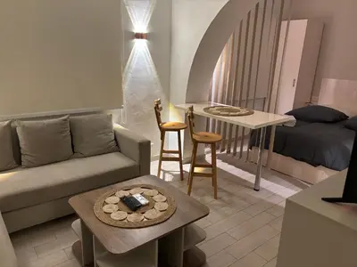 a living room with a couch and a table at Stay in the center of Elgouna in Hurghada