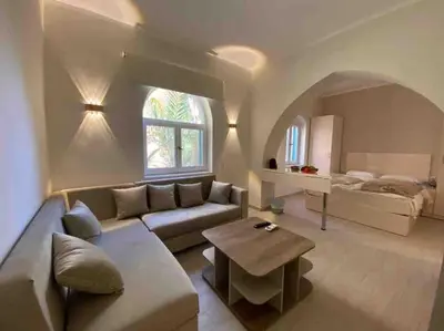 a living room with a couch and a table at Stay in the center of Elgouna in Hurghada