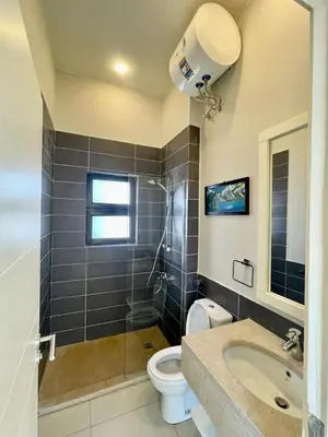 a bathroom with a toilet and a sink and a shower at tawila T 31 in Hurghada