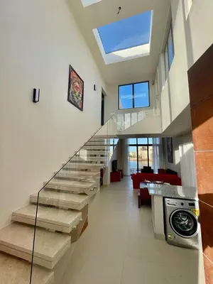 a living room with a staircase in a house at tawila T 31 in Hurghada