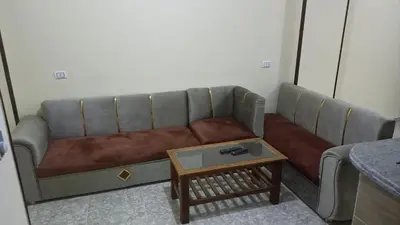 a living room with a couch and a coffee table at Ikea flat 5 in Hurghada