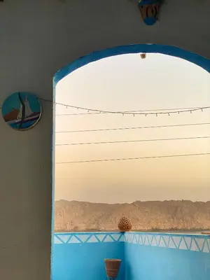 a window in a room with a view of the desert at Asilah kato nubian guest house in Aswan