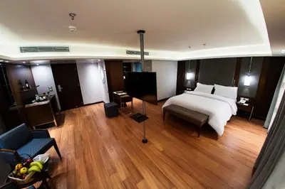 a bedroom with a bed and a chair and a couch at ToBadaa - Nile cruise all inclusive from Aswan or Luxor 4 Days & 7 days in Aswan