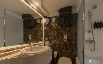 a bathroom with a sink and a shower at ToBadaa - Nile cruise all inclusive from Aswan or Luxor 4 Days & 7 days in Aswan