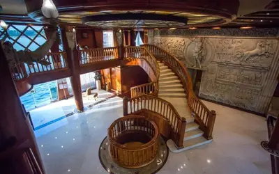 a large spiral staircase in a building with a staircase at ToBadaa - Nile cruise all inclusive from Aswan or Luxor 4 Days & 7 days in Aswan