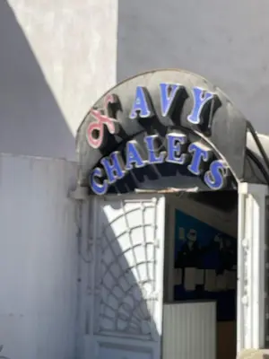 a sign for aavis garage on top of a door at Navy Chalets 107 in Hurghada