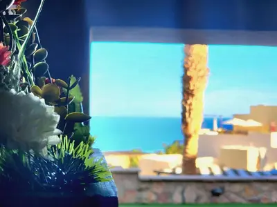 a water fountain in a window with a view of the ocean at Apartment Azzura Sahl Hasheesh with private garden in Hurghada