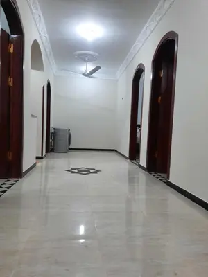 an empty room with a ceiling fan and a tile floor at The royal flat for rent in Al Qurnah