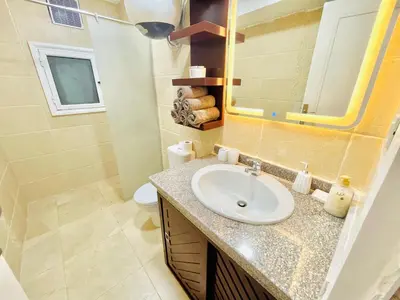 a bathroom with a sink and a mirror at Selena bay in Hurghada