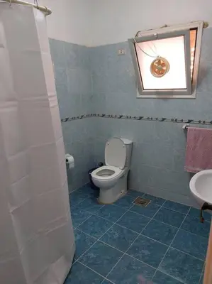 a bathroom with a toilet and a sink at Nice Studio in Elegant Compound Intercontinental Area in Hurghada