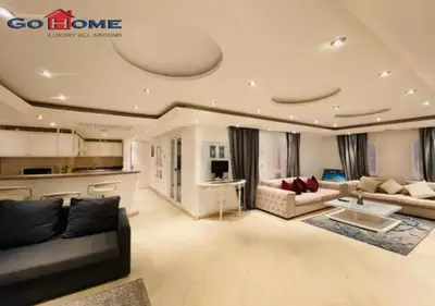 a large living room with couches and a kitchen at Pretty 4BR Penthouse MB7 with Private Heated Pool at New Marina in Hurghada
