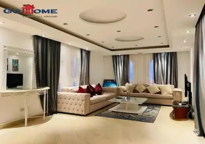 a living room with a couch and a table at Pretty 4BR Penthouse MB7 with Private Heated Pool at New Marina in Hurghada