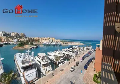 a group of boats parked in a marina at Pretty 4BR Penthouse MB7 with Private Heated Pool at New Marina in Hurghada