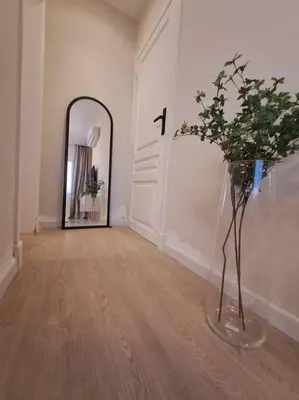 a hallway with a mirror and a vase with a plant at Luxury in the heart of Gouna in Hurghada