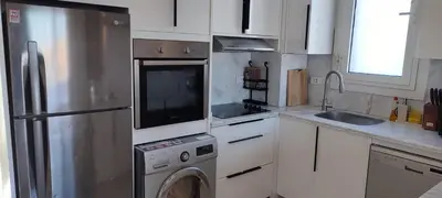 a kitchen with a stainless steel refrigerator and a dishwasher at Luxury in the heart of Gouna in Hurghada