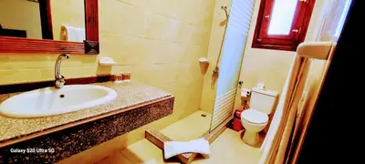 a bathroom with a sink and a toilet at Moon fourteen2 in Luxor