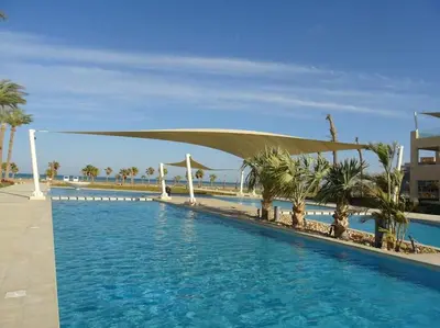 a swimming pool with a canopy over the water at Mangroovy 1br Charming Escape Hilton pool view in Hurghada