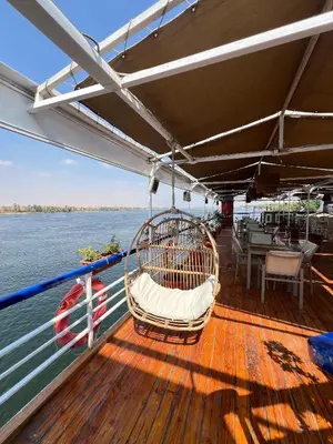 a swing on the deck of a boat on the water at Luxor Aswan Coral 2 Nile Cruise every Saturday from Luxor 4 nights & every Wednesday from Aswan 3 nights in Luxor