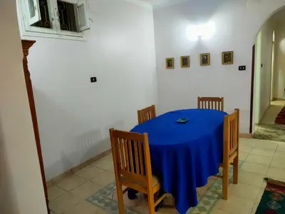 a dining room table with a blue table cloth at Top View in Luxor