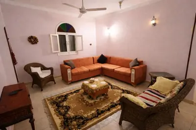 a living room with a couch and a table at Top View in Luxor